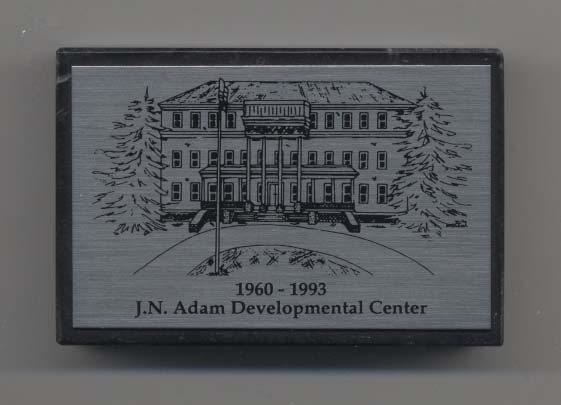 J. N. Adam Developmental Center paperweight, a souvenir of the 1993 closure ceremony.